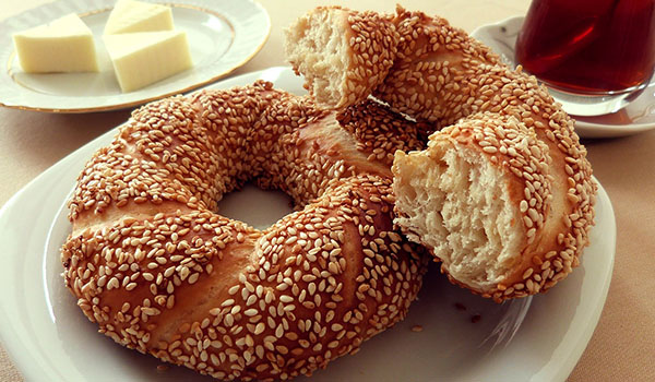 Eat a sesame seed covered pretzel