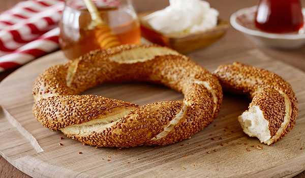 Eat a sesame seed covered pretzel
